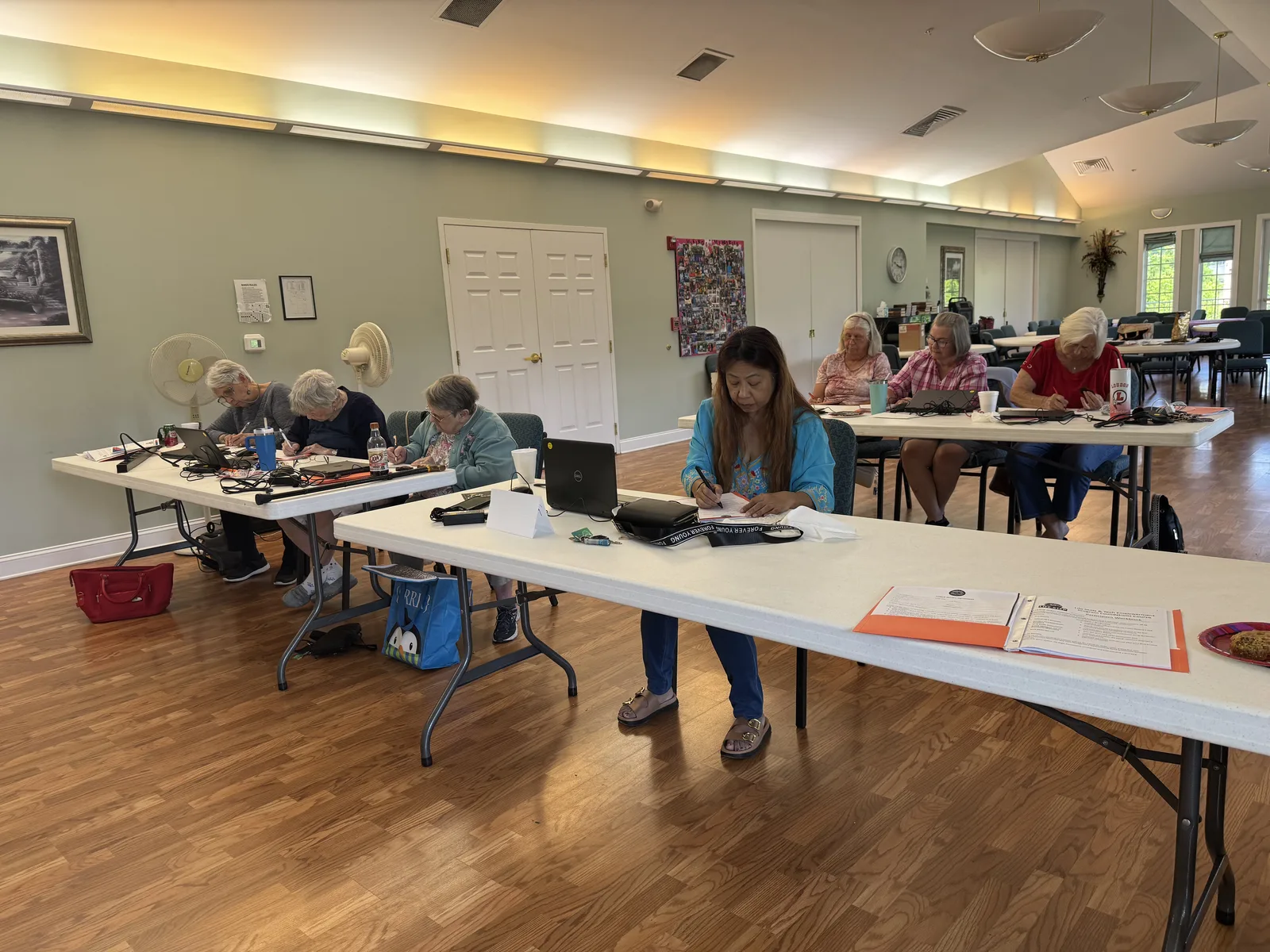 Adults building technology confidence at a senior center